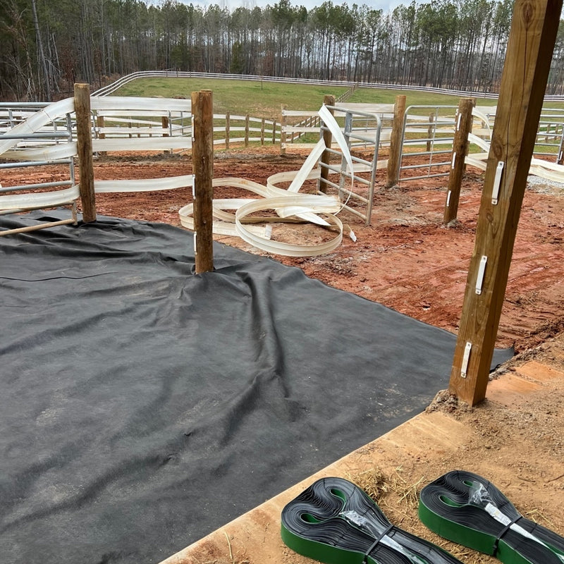 Lay geotextile fabric